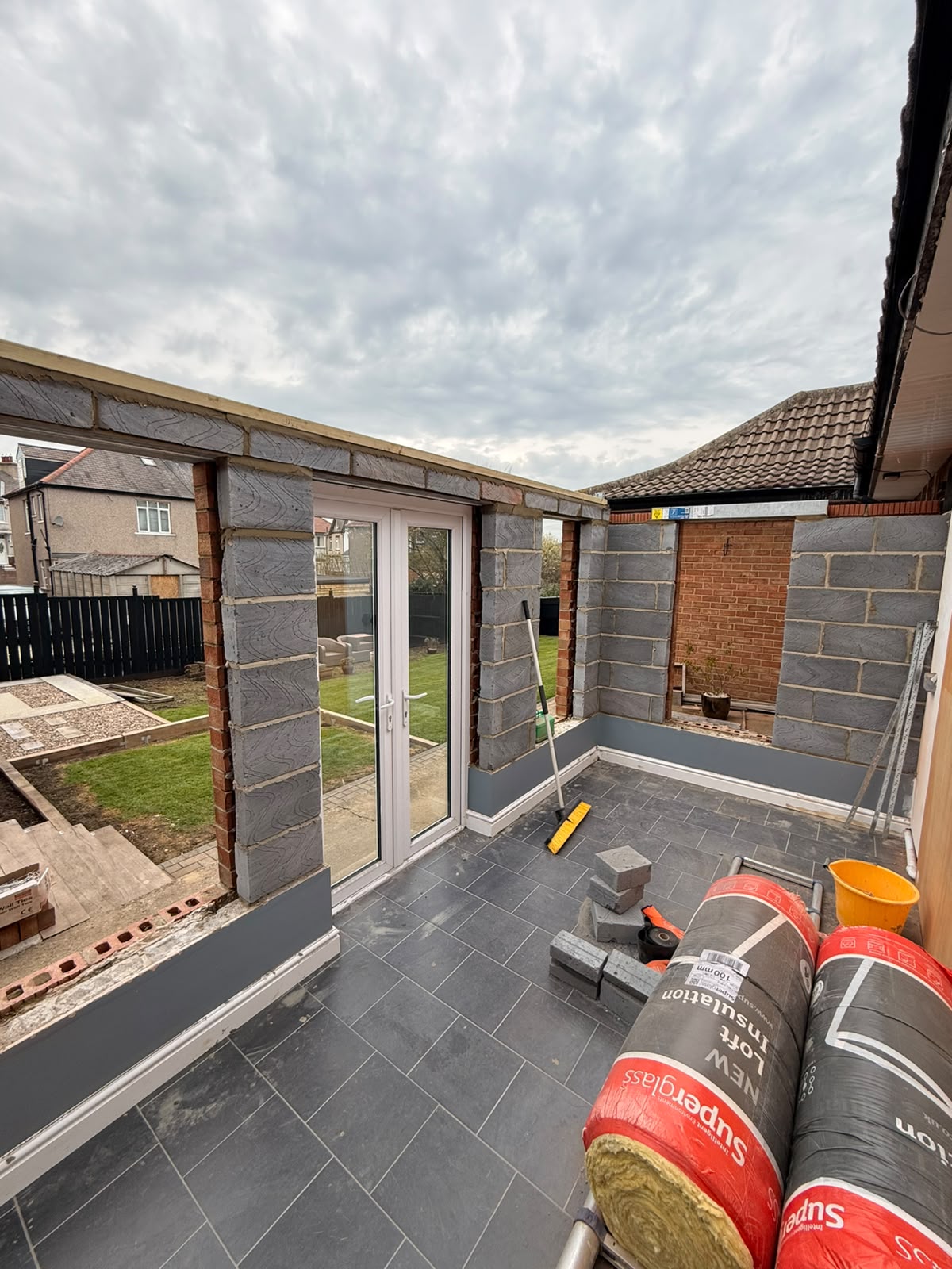 During — glazing stripped out and the new blockwork walls going up