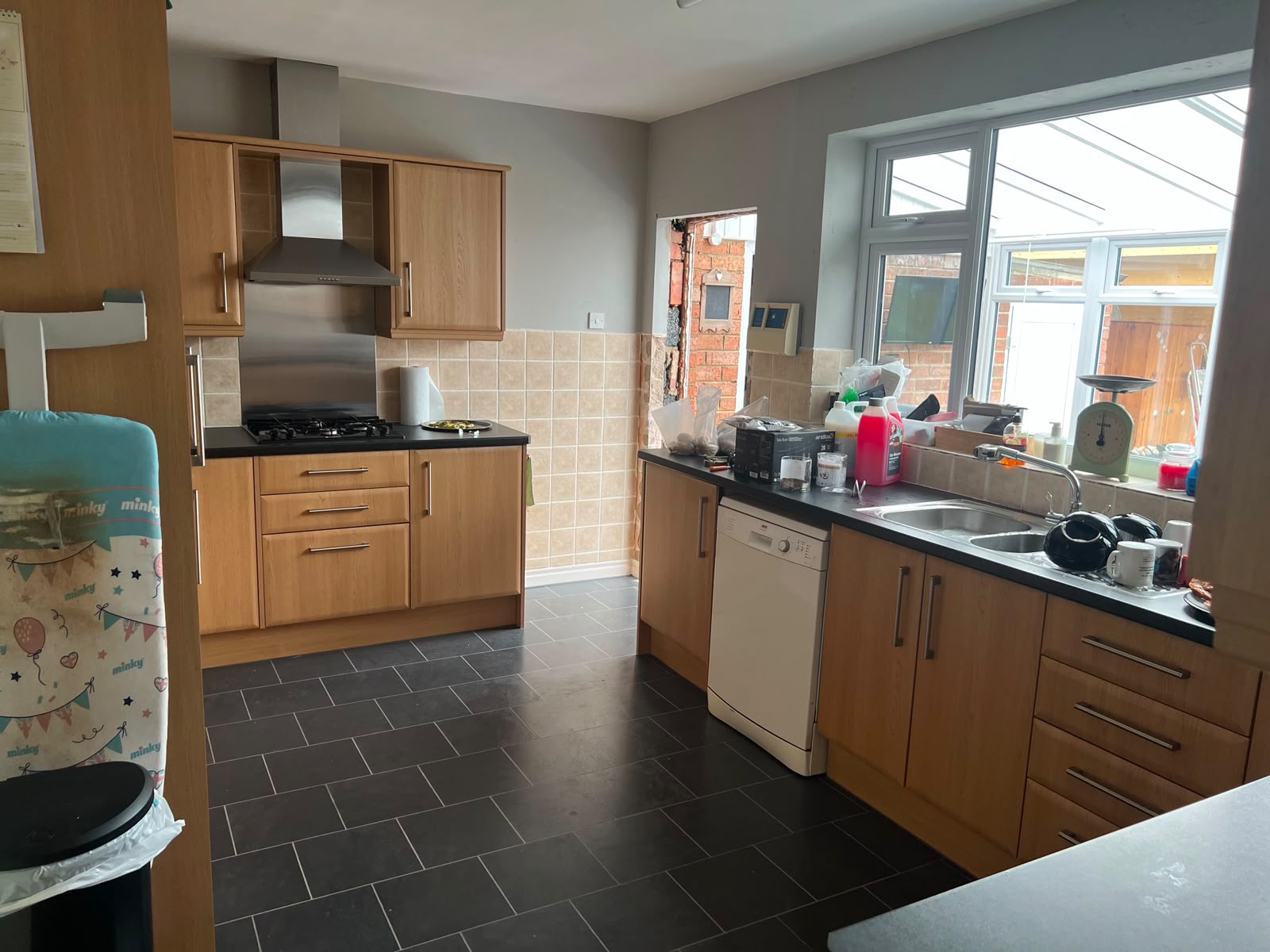 Before — the original kitchen, closed off from the conservatory