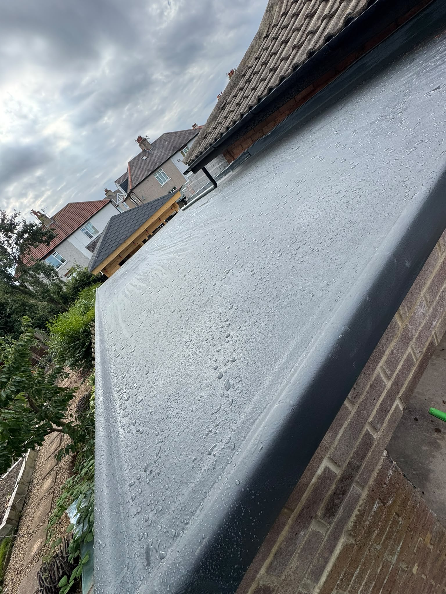 A finished seamless grey fibreglass roof on a large garage in Saltburn