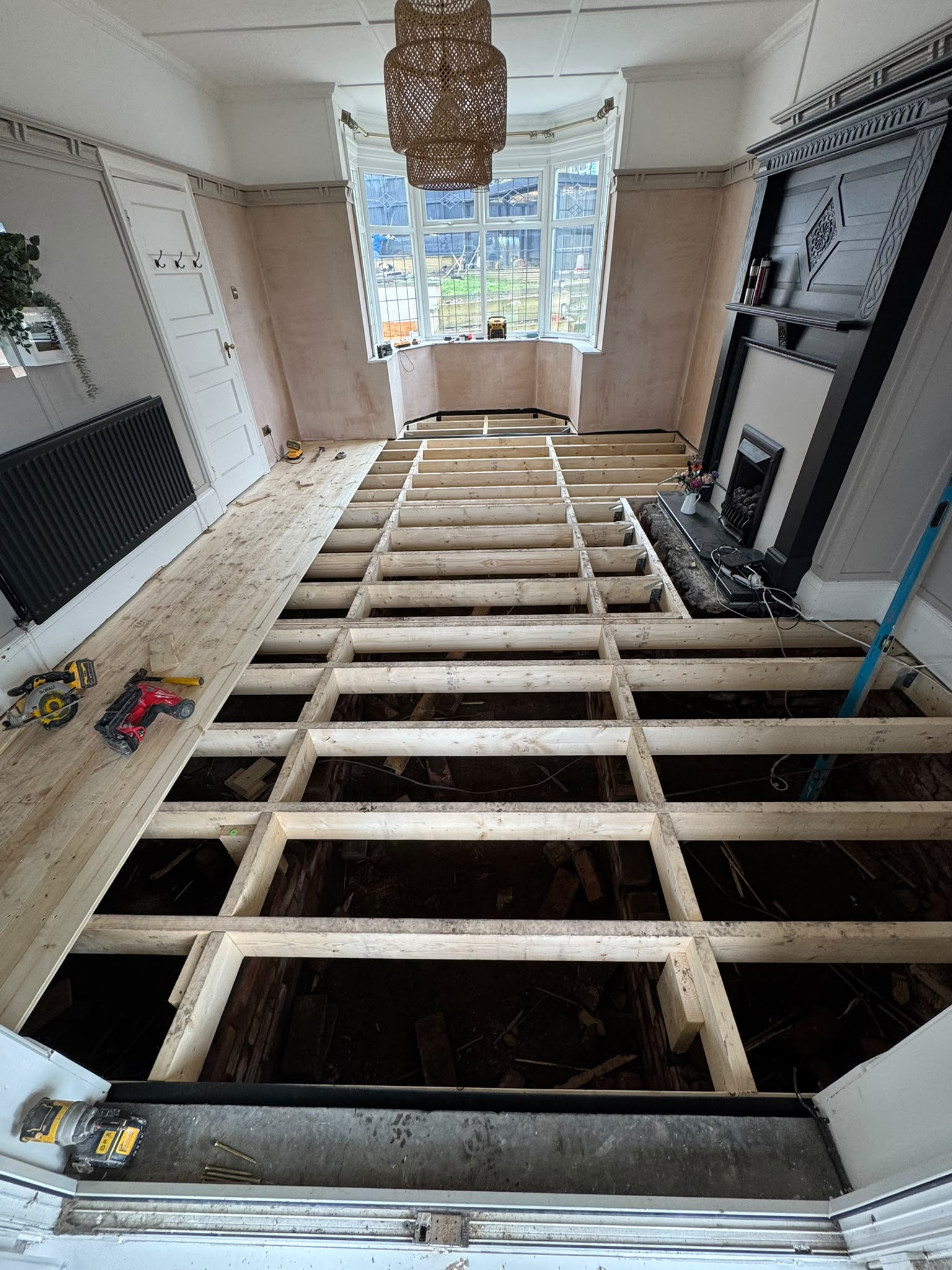 The finished replacement floor, sanded and laid through the bay window room
