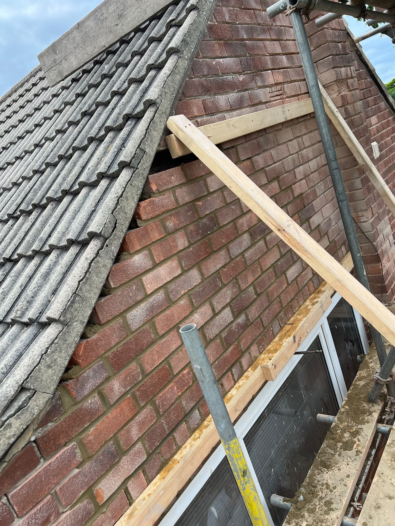 The brickwork opened up ready for the new lintels