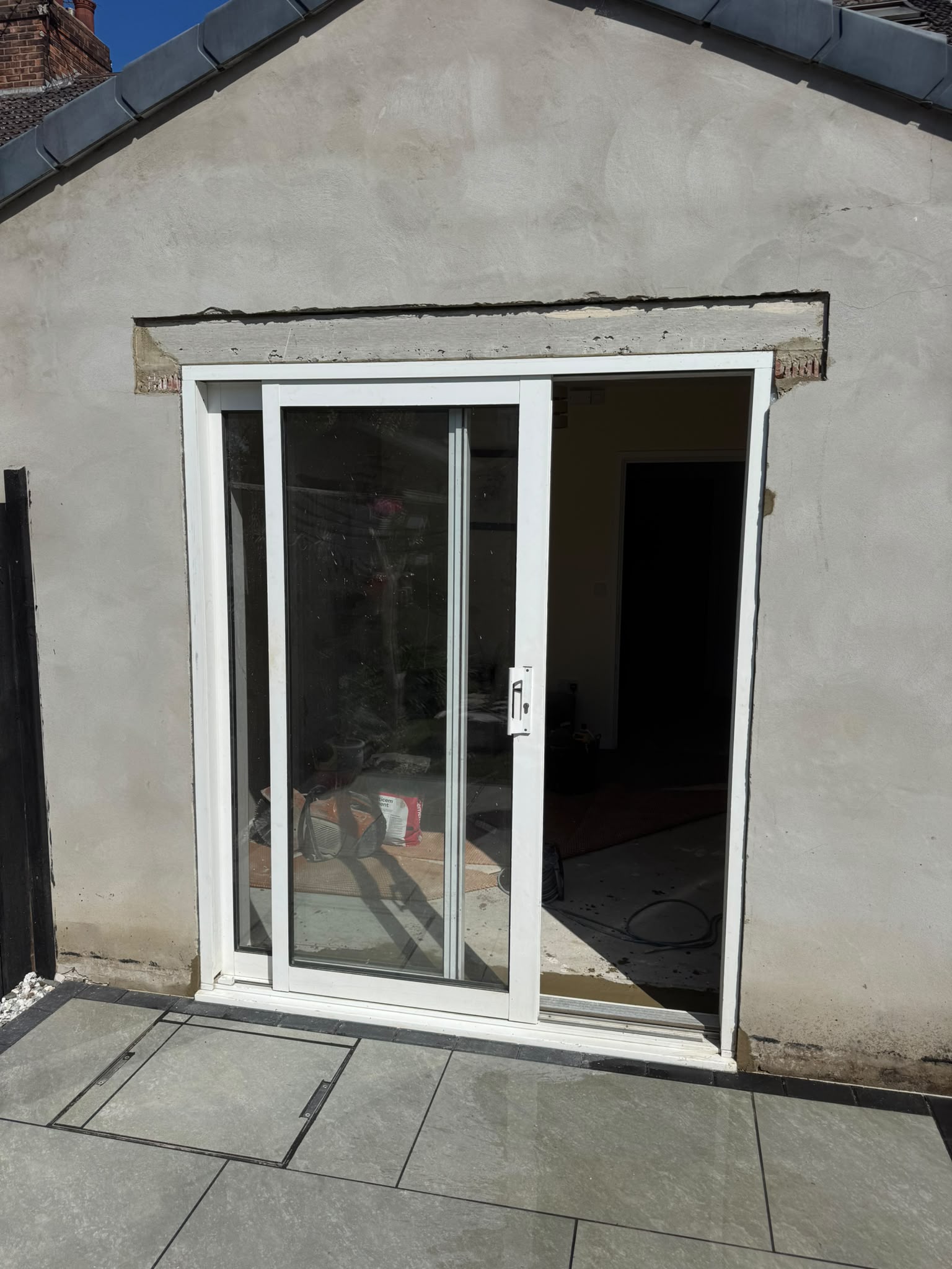 The opening cut down to floor level with a new lintel supported above