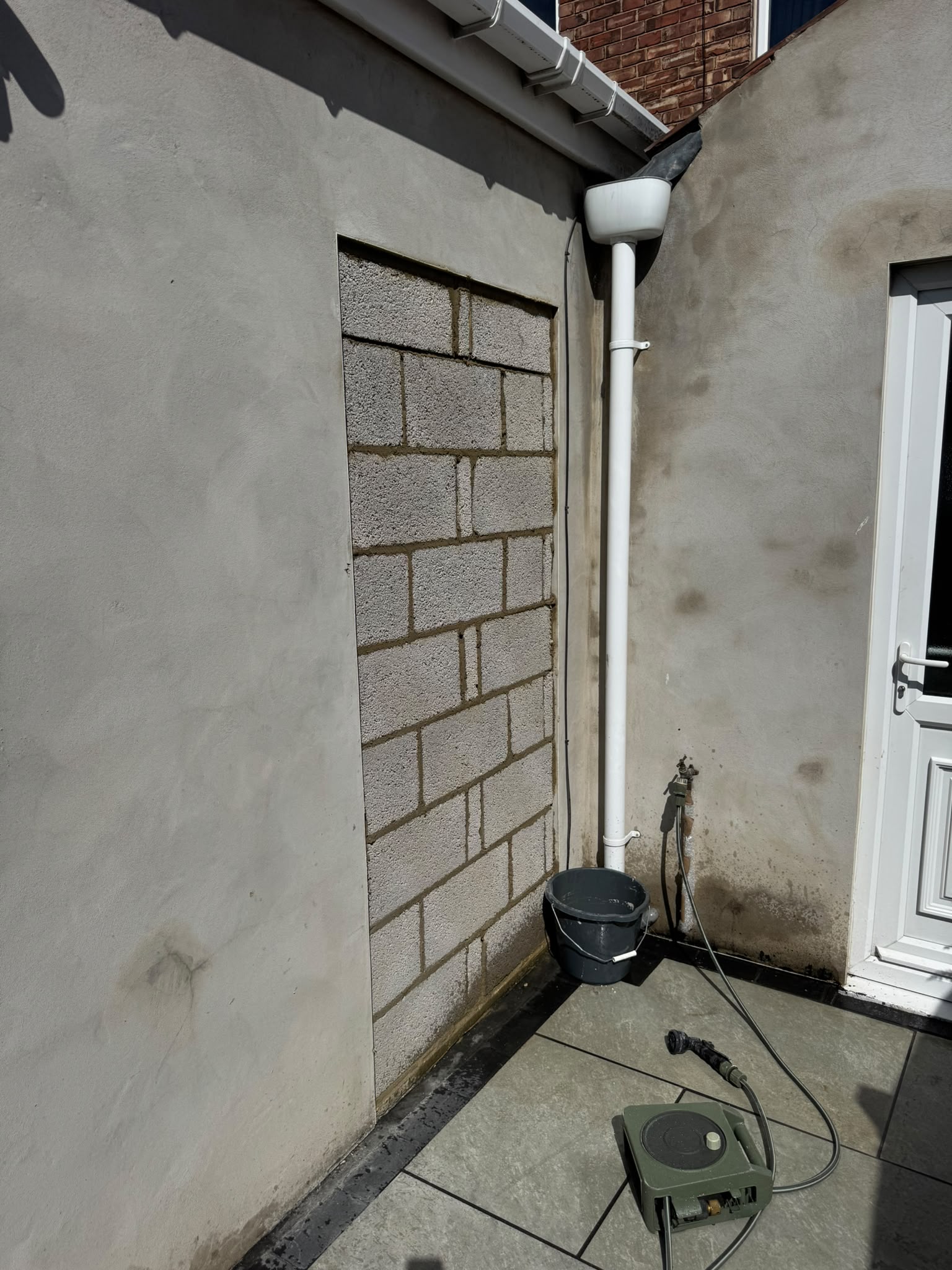 The new sliding patio door fitted where a window used to be
