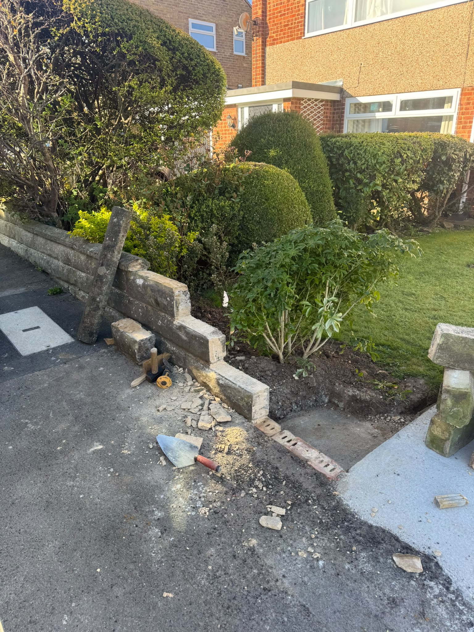 Two natural stone pillars built at a driveway entrance in Saltburn