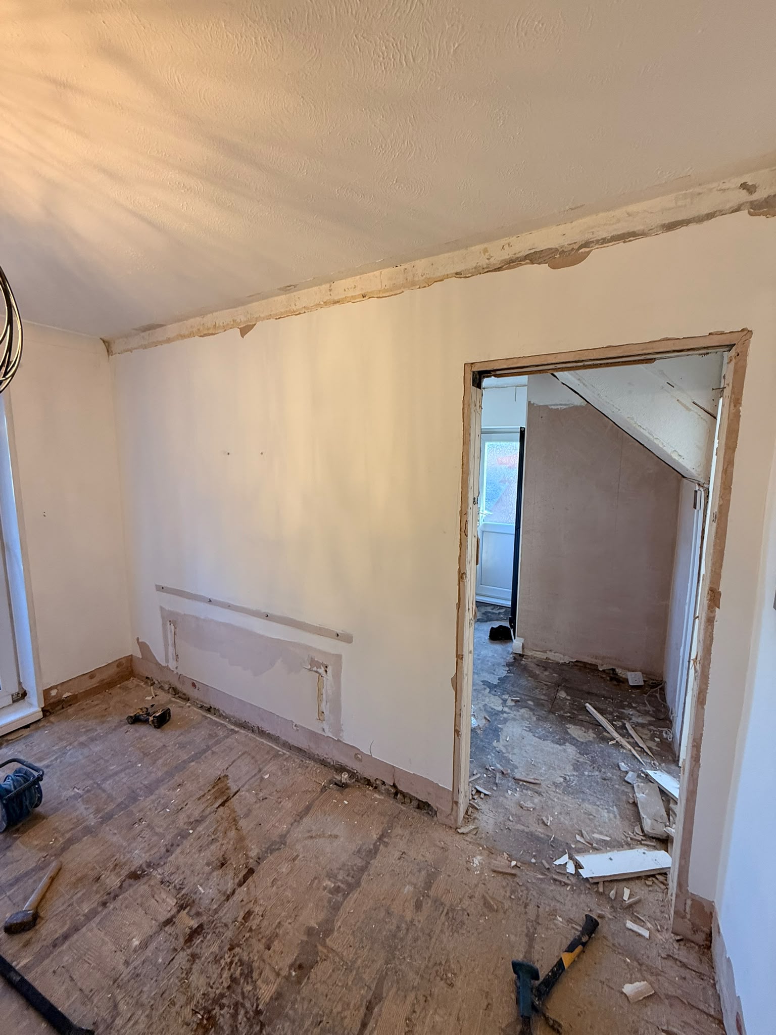 The new structural opening formed between the kitchen and dining room